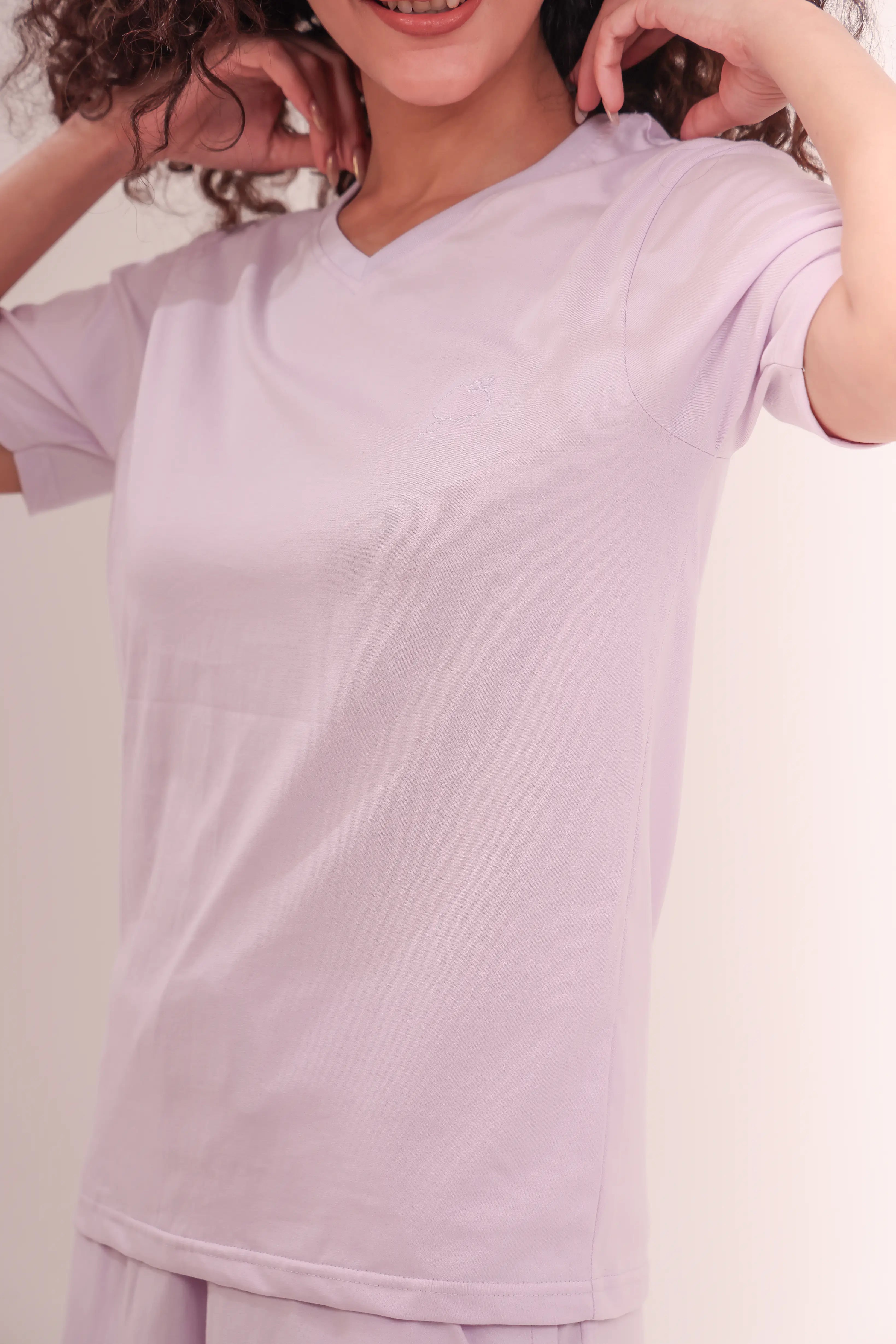 Close-up of woman wearing Lavender V-Neck Tee made from breathable 100% cotton by NapStory
