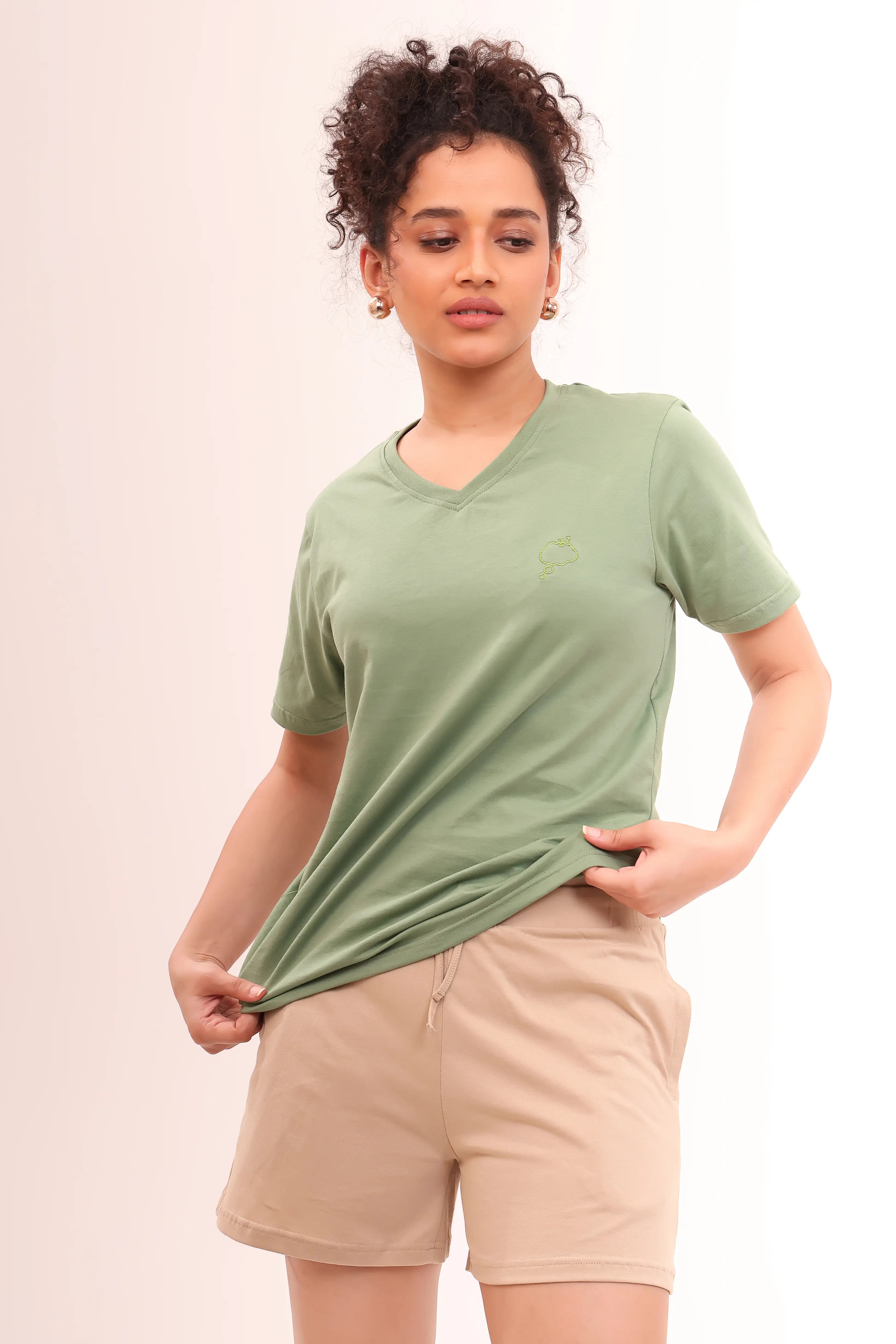 Woman wearing Basic Leaf Green V-Neck Tee made from breathable 100% cotton by NapStory