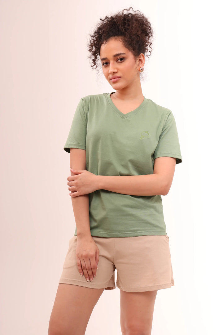 Lady standing in Basic Leaf Green Cotton V-Neck Tee with short sleeves by NapStory