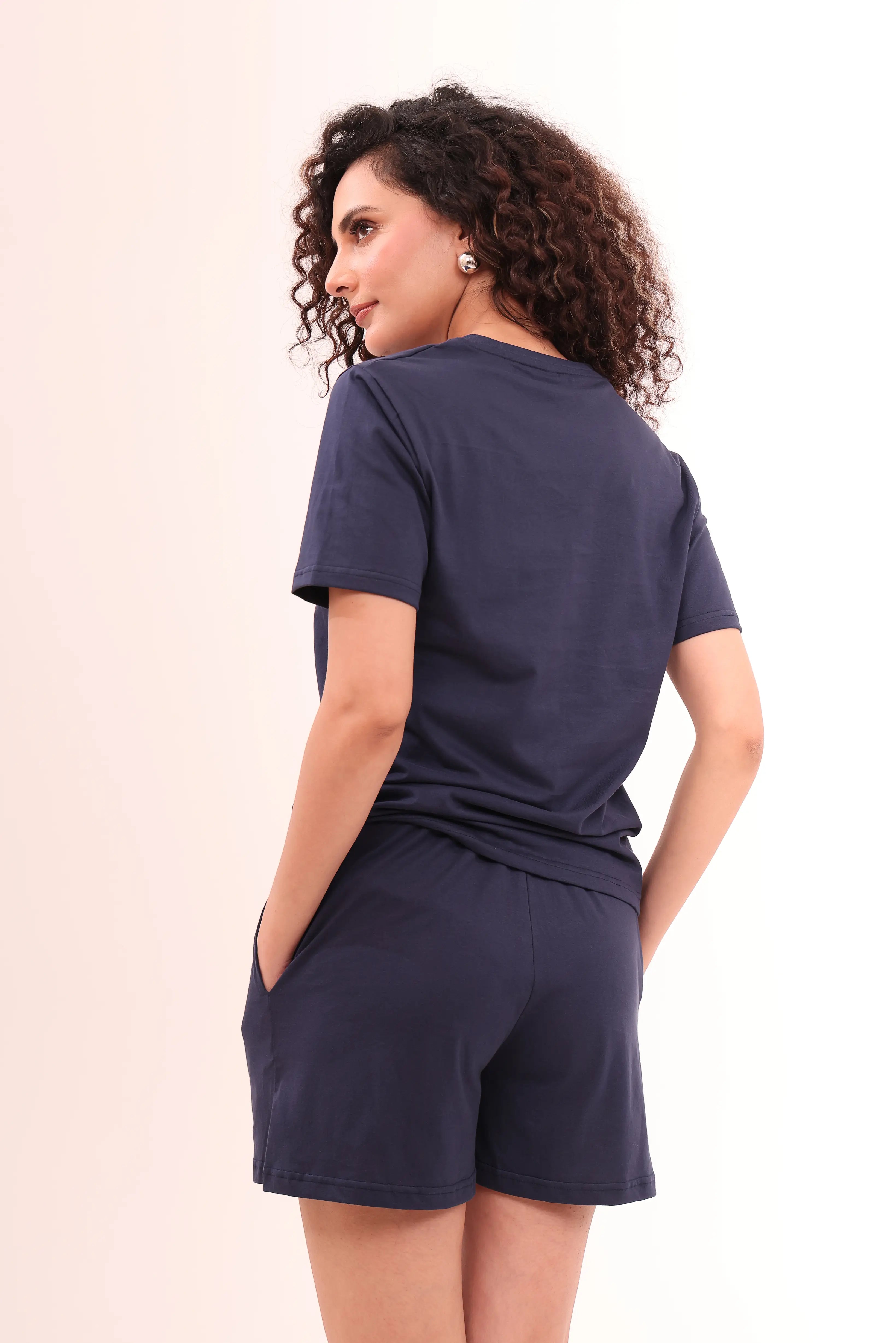Back view of woman wearing Basic Navy V-Neck Tee crafted from 100% cotton by NapStory