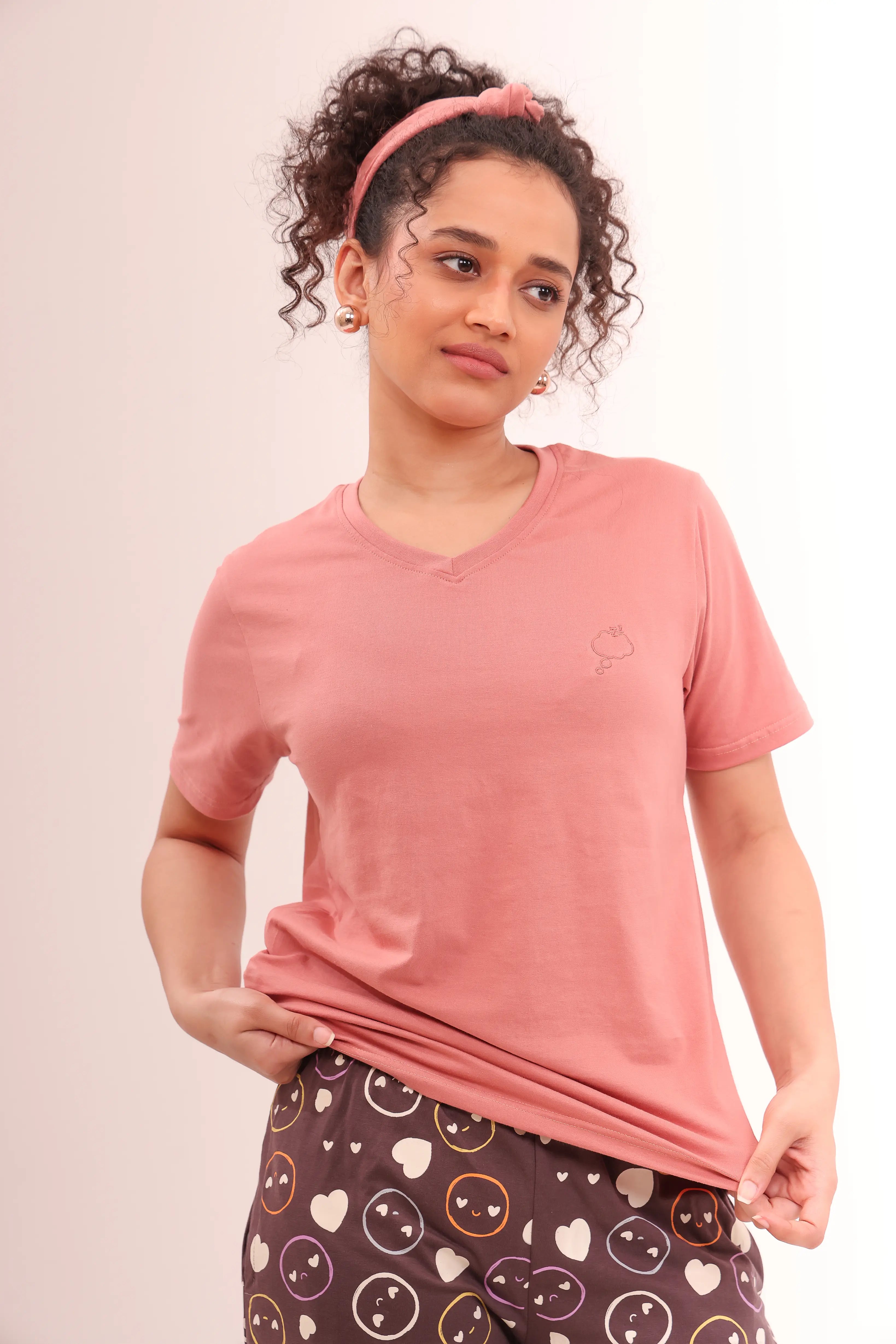 Woman wearing Rose Pink V-Neck Tee styled as cotton nightwear by NapStory