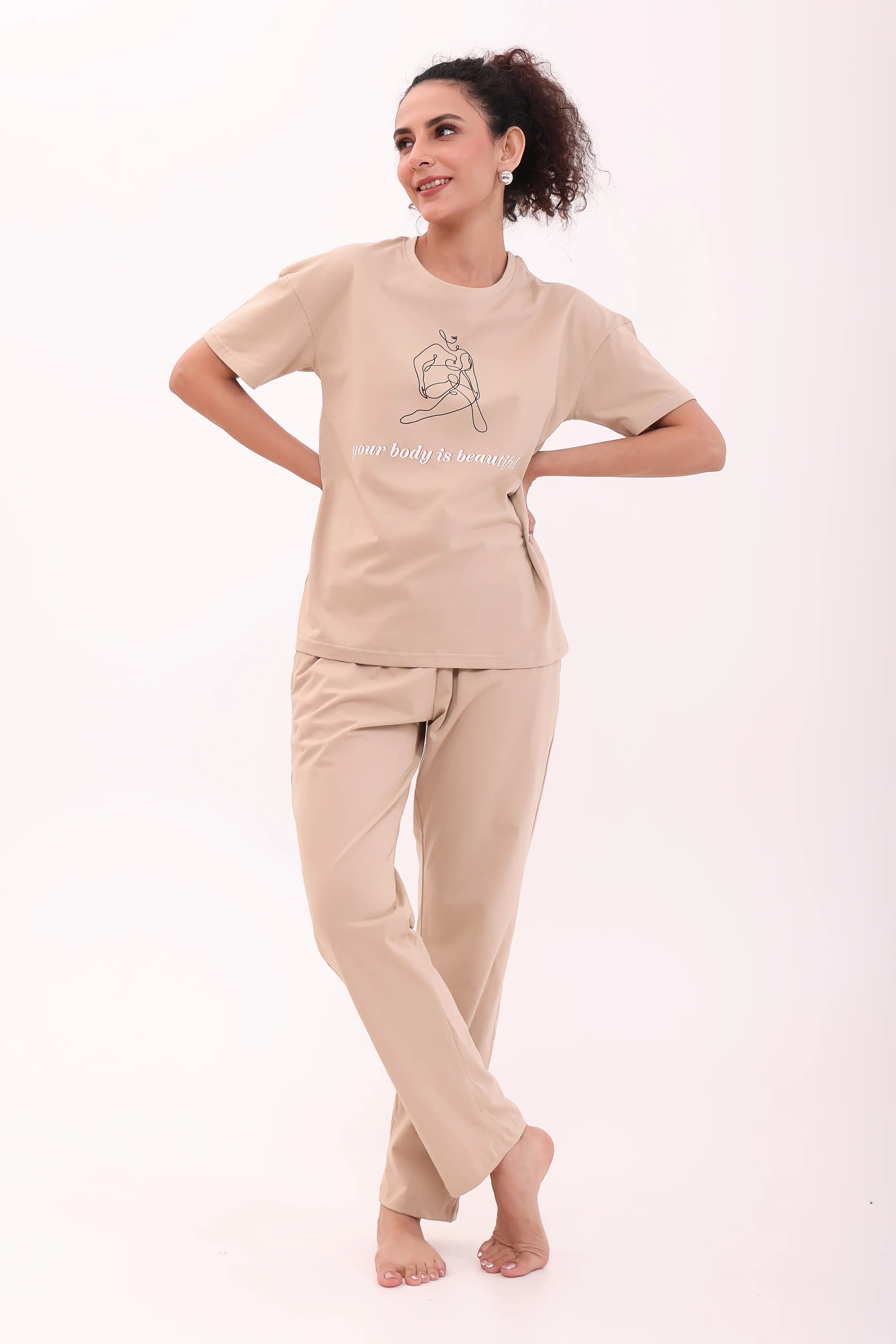 Woman posing in sand cotton pyjama and printed beige tee, cozy loungewear by NapStory