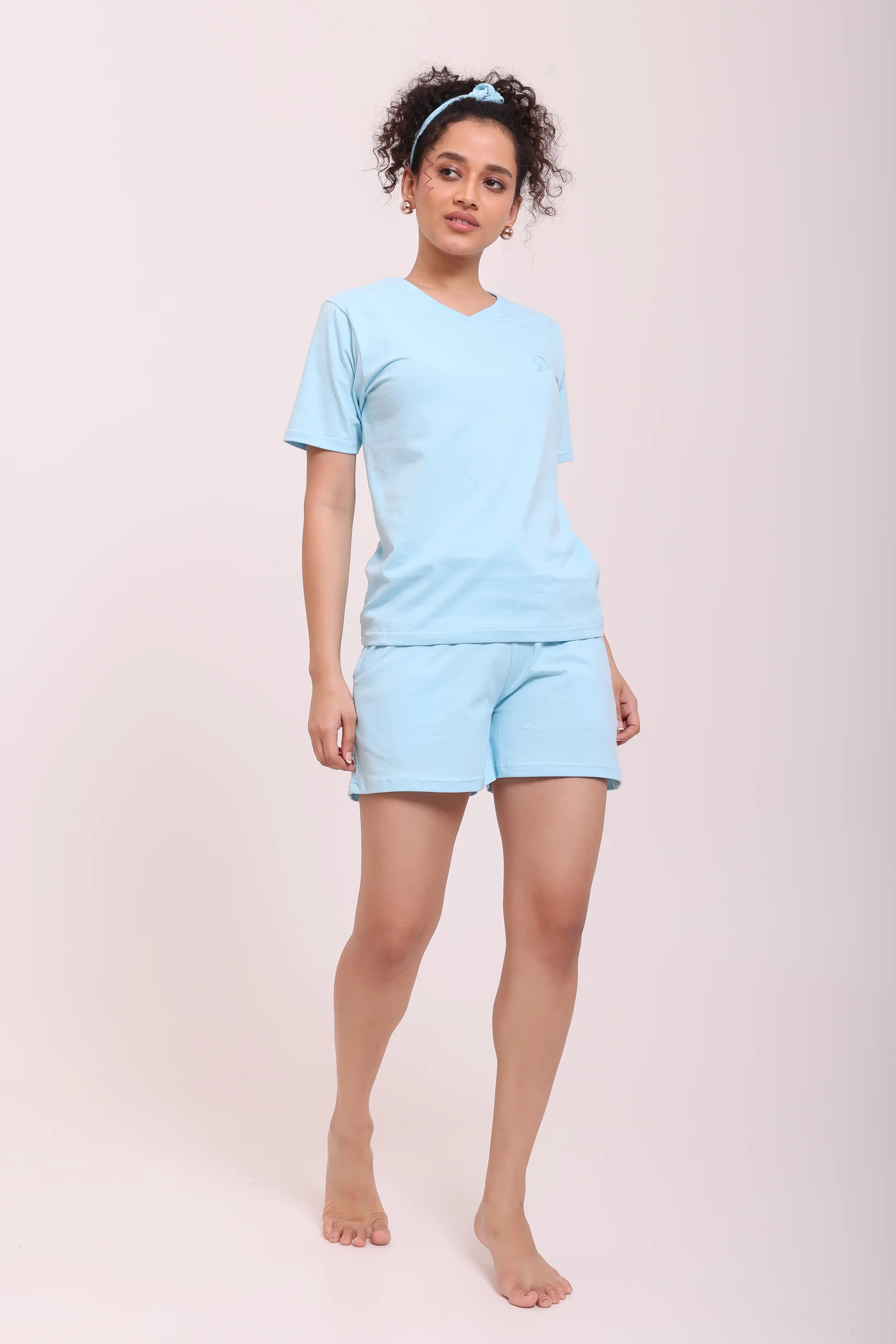 Full-length view of woman in Basic Sky Blue V-Neck Tee made with soft cotton loungewear by NapStory