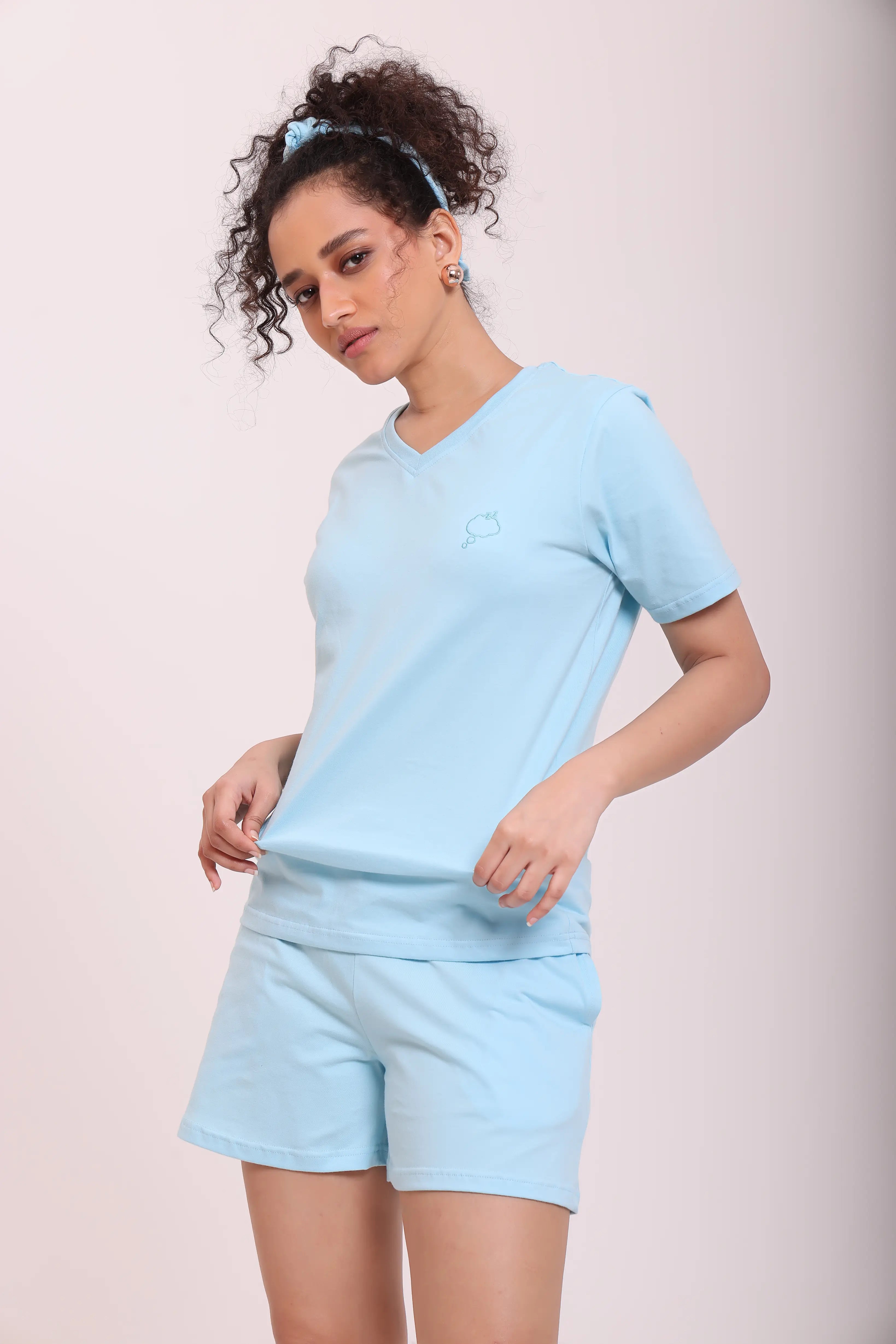 Woman showcasing Basic Sky Blue Cotton V-Neck Tee for everyday wear by NapStory