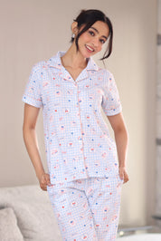Woman wearing a patterned pajama set in a casual setting