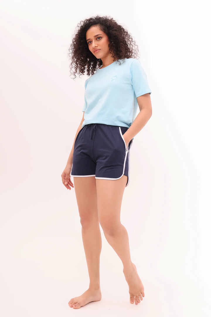 Woman wearing sky blue tee with navy shorts comfortable cotton nightwear by NapStory