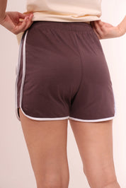 Back view of brown piped-up shorts showing relaxed fit and piping trim by NapStory