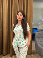 Girl in a Smiley Print Pyjama Set nightwear by NapStory, confidently standing with a stylish look.