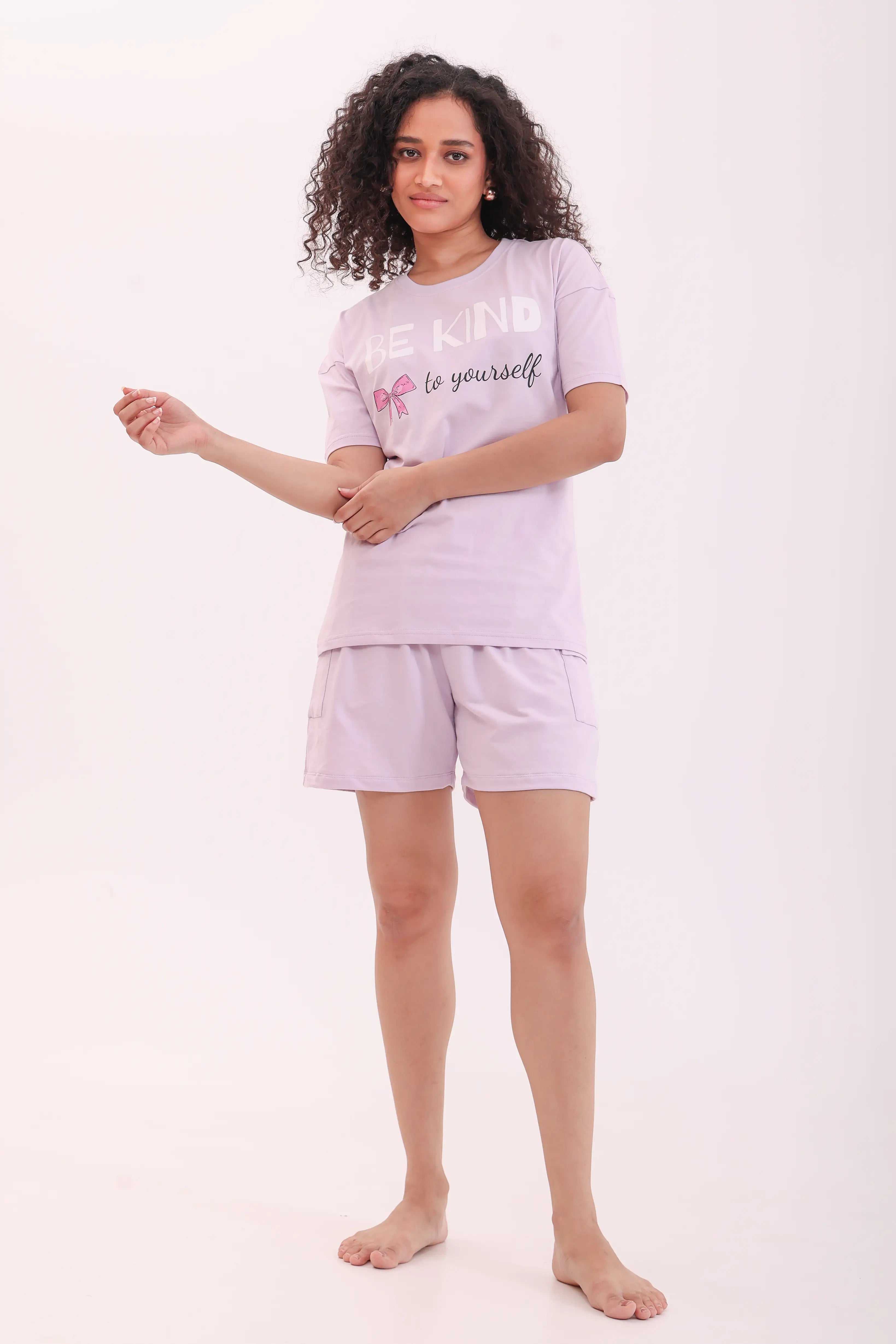Woman posing in lavender oversized printed tee and shorts, a perfect loungewear by NapStory