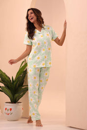 Woman standing and smiling while wearing 100% cotton Spring Fizz Printed Pyjama Set by NapStory