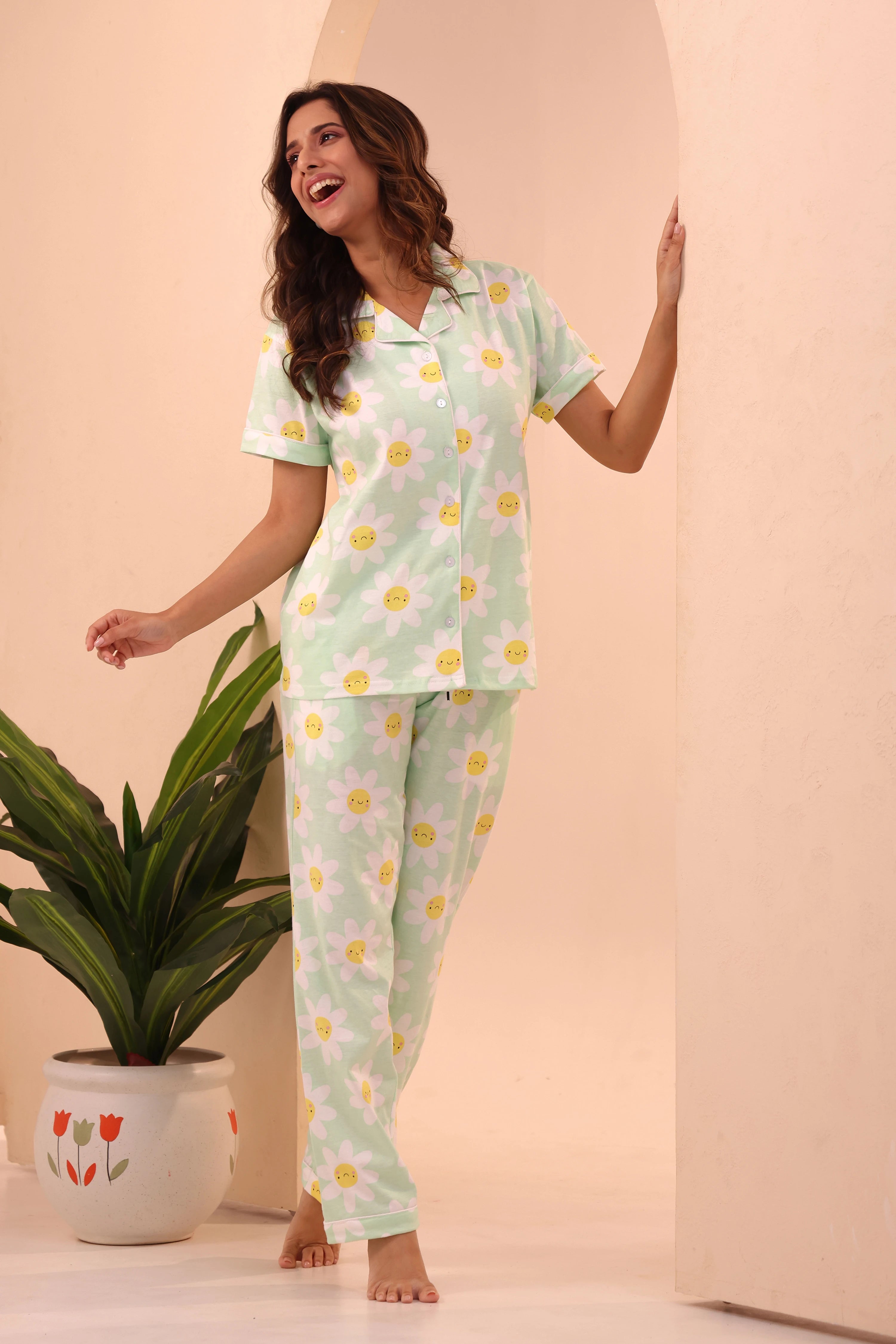 Woman standing and smiling while wearing 100% cotton Spring Fizz Printed Pyjama Set by NapStory