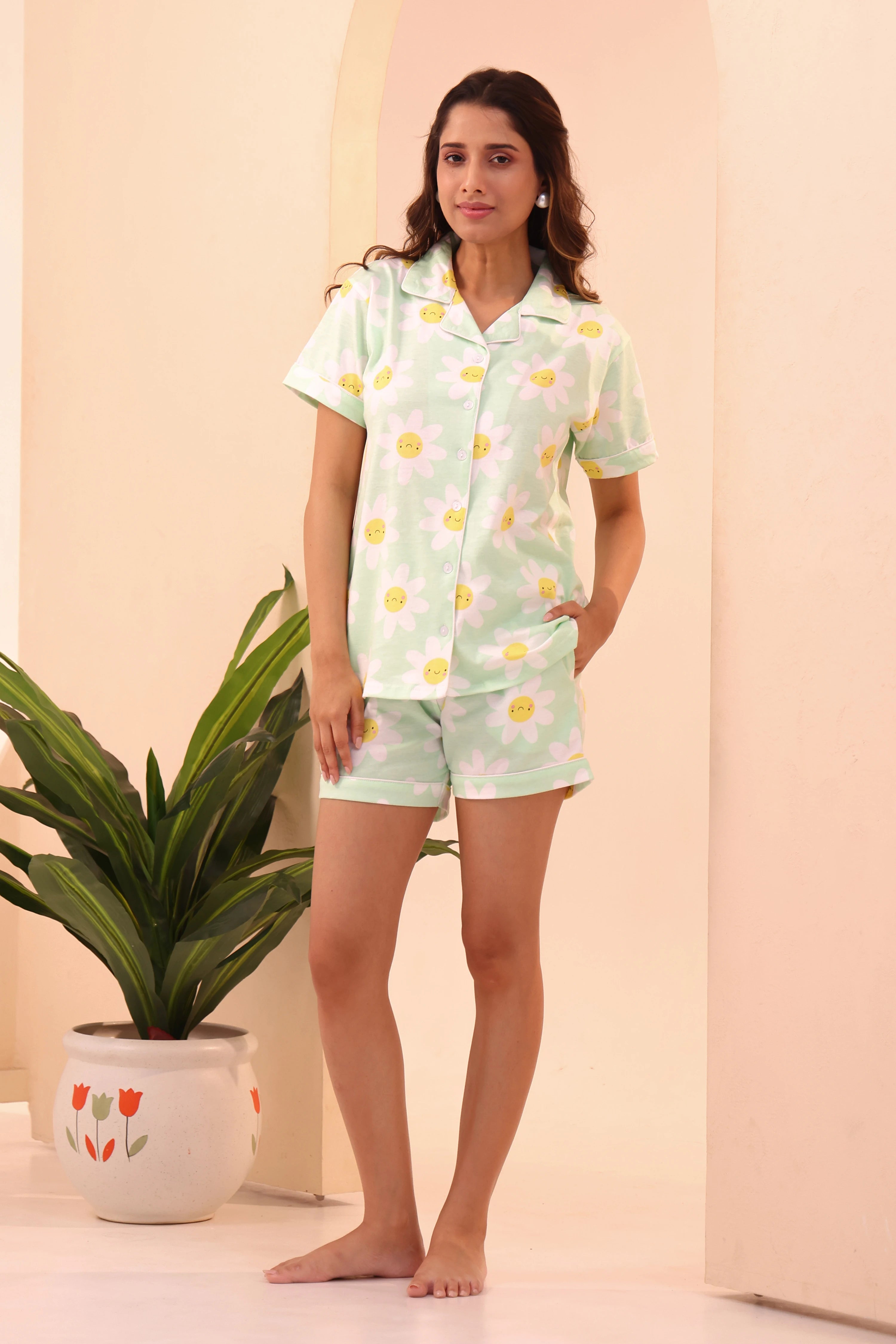 Woman standing barefoot wearing Spring Fizz Shorts Set night suit by NapStory.