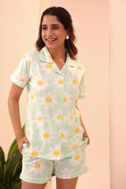 Woman posing with hands in pockets in Spring Fizz Shorts Set night suit by NapStory.