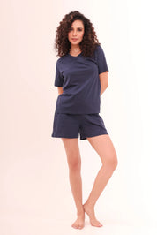 Full-length view of woman in Basic Navy V-Neck Tee crafted in soft cotton loungewear by NapStory