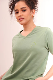 Close-up of Basic Leaf Green V-Neck Tee highlighting V-neck and cotton fabric by NapStory