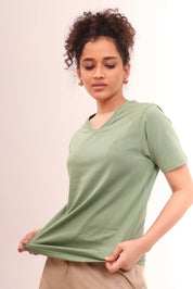 Young girl showcasing breathable cotton Leaf Green V-Neck Tee by NapStory