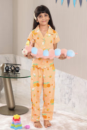 A child wearing a matching outfit with colorful toys in a room.