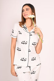 Young lady in a Panda Print Pyjama Set nightwear by NapStory, looking cozy and stylish.
